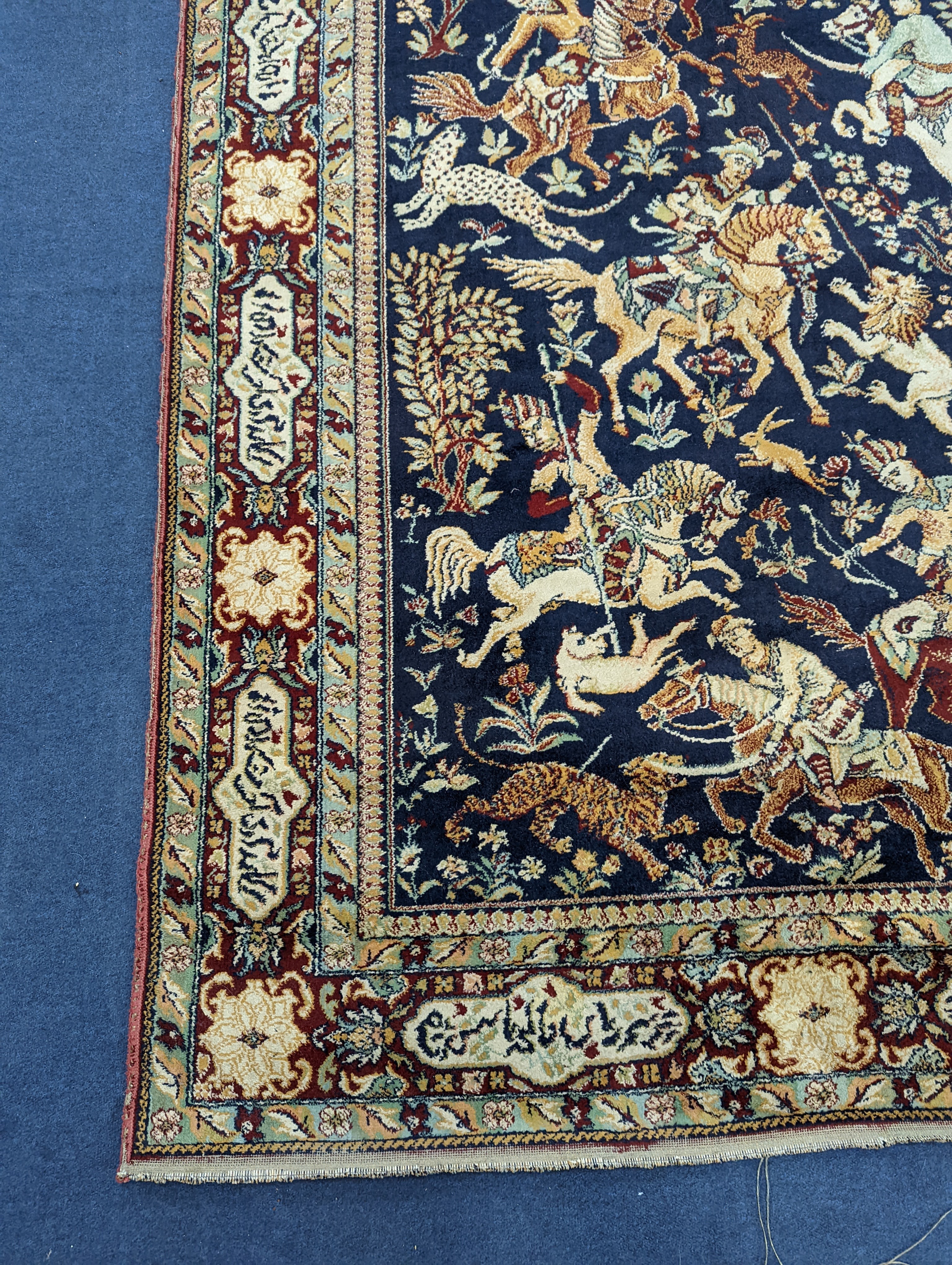 A Kashan style blue ground pictorial rug, 224 x 144cm